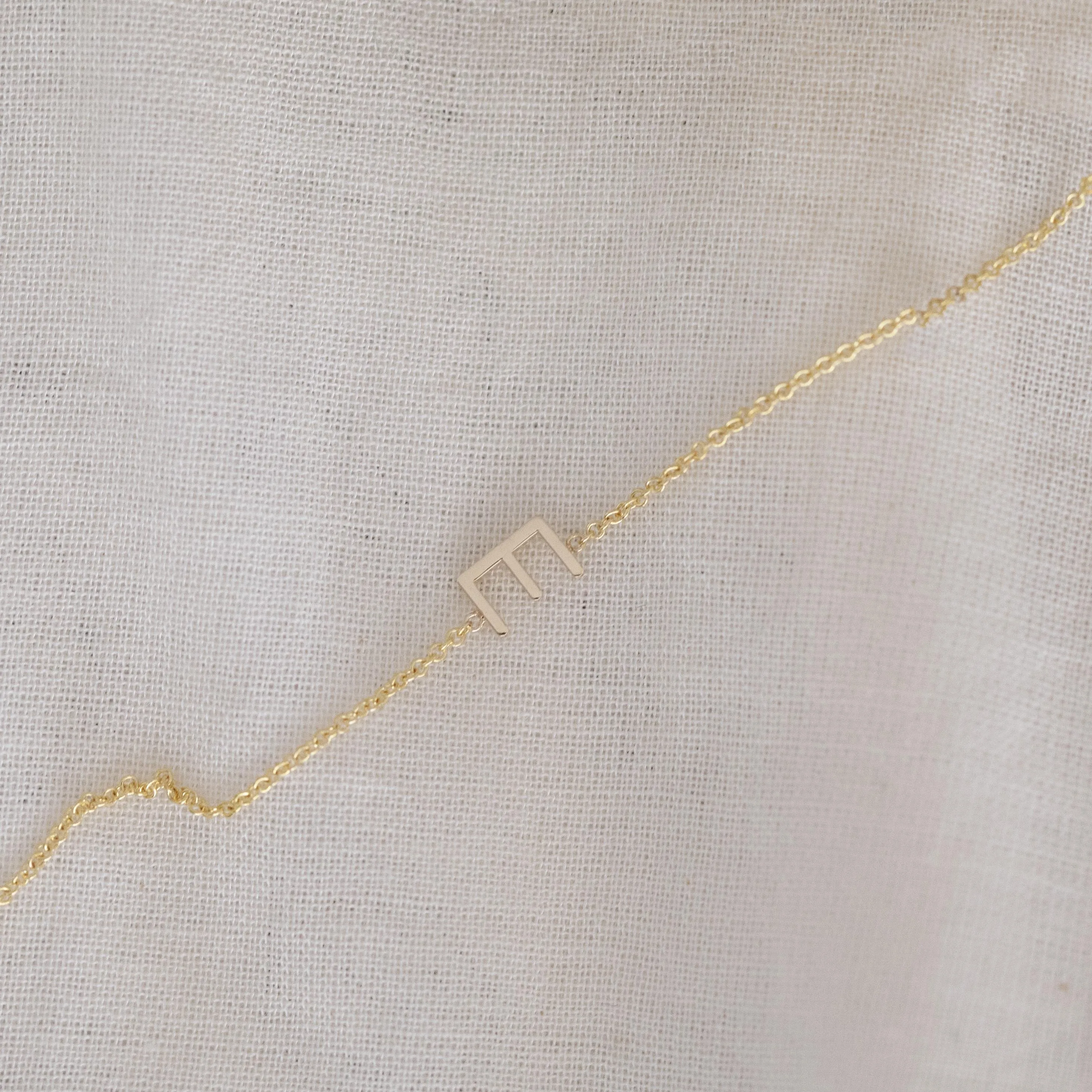 14K GOLD ASYMMETRICAL LETTER NECKLACE - E